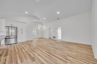 Welcome to this beautifully updated home in the sought-after on Kings Ridge Golf Club in Florida - for sale on GolfHomes.com, golf home, golf lot