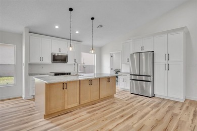 Welcome to this beautifully updated home in the sought-after on Kings Ridge Golf Club in Florida - for sale on GolfHomes.com, golf home, golf lot