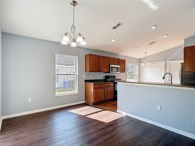 Great home with a gated entry, a well-maintained community, and on Meadow Oaks Golf and Country Club in Florida - for sale on GolfHomes.com, golf home, golf lot