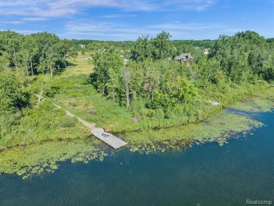Must see this massive 2.28 acre vacant lot with 132 ft of on Spring Meadows Country Club in Michigan - for sale on GolfHomes.com, golf home, golf lot