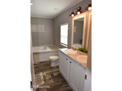 Welcome to this beautifully maintained 3-bedroom, 2-bath home on Woodlake Golf Club in Tennessee - for sale on GolfHomes.com, golf home, golf lot