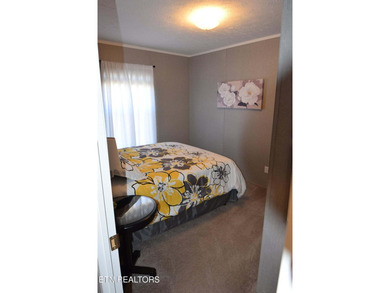 Welcome to this beautifully maintained 3-bedroom, 2-bath home on Woodlake Golf Club in Tennessee - for sale on GolfHomes.com, golf home, golf lot