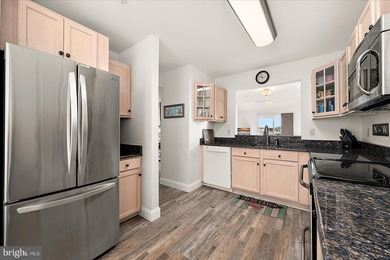 Discover waterfront living at its finest in this top floor, end on Bethany Bay Golf Club in Delaware - for sale on GolfHomes.com, golf home, golf lot