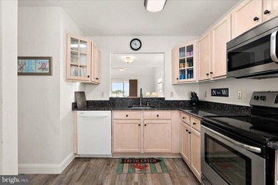 Discover waterfront living at its finest in this top floor, end on Bethany Bay Golf Club in Delaware - for sale on GolfHomes.com, golf home, golf lot