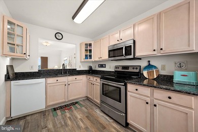 Discover waterfront living at its finest in this top floor, end on Bethany Bay Golf Club in Delaware - for sale on GolfHomes.com, golf home, golf lot