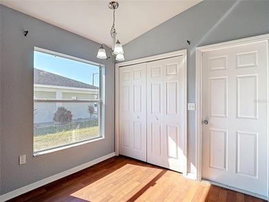 Great home with a gated entry, a well-maintained community, and on Meadow Oaks Golf and Country Club in Florida - for sale on GolfHomes.com, golf home, golf lot