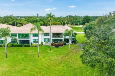 Double fairway views from this lovely second-floor residence on Quail Ridge Golf Course and Country Club in Florida - for sale on GolfHomes.com, golf home, golf lot