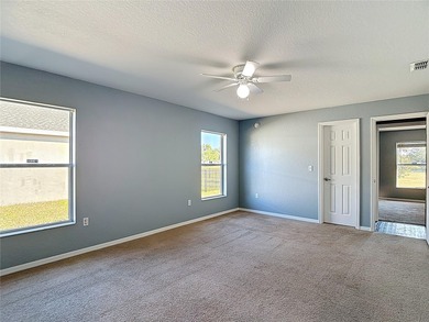 Great home with a gated entry, a well-maintained community, and on Meadow Oaks Golf and Country Club in Florida - for sale on GolfHomes.com, golf home, golf lot