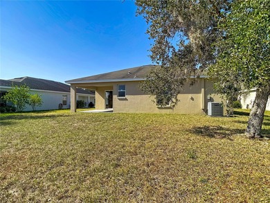 Great home with a gated entry, a well-maintained community, and on Meadow Oaks Golf and Country Club in Florida - for sale on GolfHomes.com, golf home, golf lot