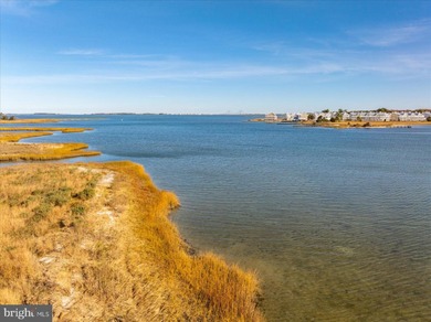 Discover waterfront living at its finest in this top floor, end on Bethany Bay Golf Club in Delaware - for sale on GolfHomes.com, golf home, golf lot