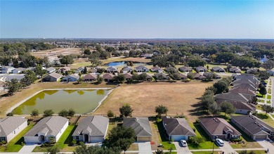 Great home with a gated entry, a well-maintained community, and on Meadow Oaks Golf and Country Club in Florida - for sale on GolfHomes.com, golf home, golf lot