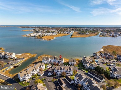 Discover waterfront living at its finest in this top floor, end on Bethany Bay Golf Club in Delaware - for sale on GolfHomes.com, golf home, golf lot