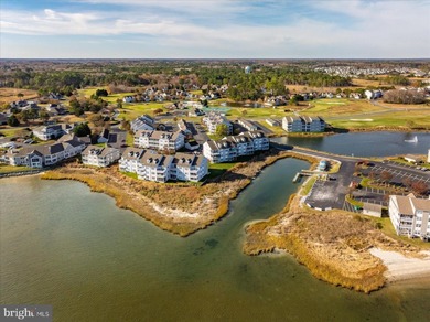 Discover waterfront living at its finest in this top floor, end on Bethany Bay Golf Club in Delaware - for sale on GolfHomes.com, golf home, golf lot