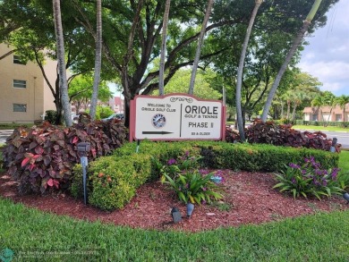 Experience Florida living in this spacious, bright unit located on Oriole Golf and Tennis Club in Florida - for sale on GolfHomes.com, golf home, golf lot