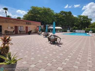 Experience Florida living in this spacious, bright unit located on Oriole Golf and Tennis Club in Florida - for sale on GolfHomes.com, golf home, golf lot