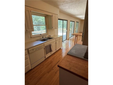 Lake View Home with Workshop  Great Potential!

This 3-bedroom on Holiday Island Executive Golf Course in Arkansas - for sale on GolfHomes.com, golf home, golf lot