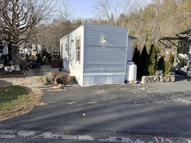 AMAZINGLY beautiful CREEK lot with a 2010 Heritage Park Model! on Bent Creek Golf Course in Tennessee - for sale on GolfHomes.com, golf home, golf lot