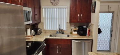 Updated 2 bed 2 bath in Sunrise Lakes Solid Wood Cherry Shaker on Sunrise Lakes Phase III in Florida - for sale on GolfHomes.com, golf home, golf lot