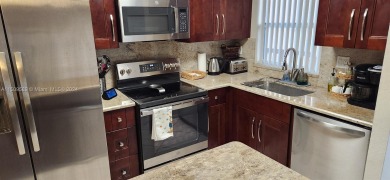 Updated 2 bed 2 bath in Sunrise Lakes Solid Wood Cherry Shaker on Sunrise Lakes Phase III in Florida - for sale on GolfHomes.com, golf home, golf lot