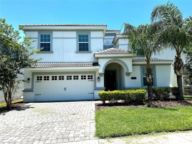 This spacious 8-bedroom, 5-bathroom home in a gated community on The Oasis Club at Champions Gate in Florida - for sale on GolfHomes.com, golf home, golf lot
