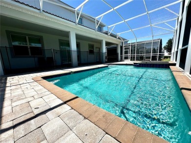 This spacious 8-bedroom, 5-bathroom home in a gated community on The Oasis Club at Champions Gate in Florida - for sale on GolfHomes.com, golf home, golf lot