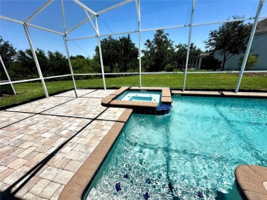 This spacious 8-bedroom, 5-bathroom home in a gated community on The Oasis Club at Champions Gate in Florida - for sale on GolfHomes.com, golf home, golf lot