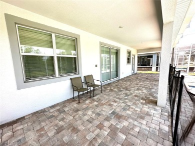 This spacious 8-bedroom, 5-bathroom home in a gated community on The Oasis Club at Champions Gate in Florida - for sale on GolfHomes.com, golf home, golf lot