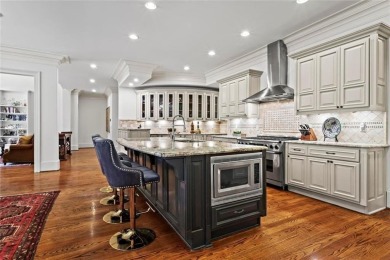 Welcome to an extraordinary six-bedroom, seven full and two on The Golf Club of Georgia in Georgia - for sale on GolfHomes.com, golf home, golf lot