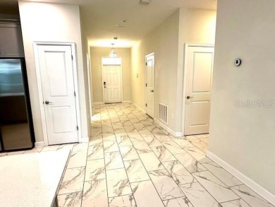 This spacious 8-bedroom, 5-bathroom home in a gated community on The Oasis Club at Champions Gate in Florida - for sale on GolfHomes.com, golf home, golf lot