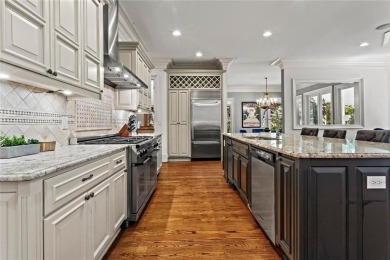 Welcome to an extraordinary six-bedroom, seven full and two on The Golf Club of Georgia in Georgia - for sale on GolfHomes.com, golf home, golf lot