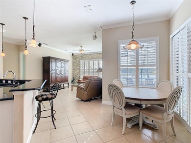 Stunning OPERETTA model on a HUGE POND in the Terra Vista on Stonegate Golf Club in Florida - for sale on GolfHomes.com, golf home, golf lot