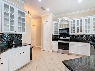 Stunning OPERETTA model on a HUGE POND in the Terra Vista on Stonegate Golf Club in Florida - for sale on GolfHomes.com, golf home, golf lot