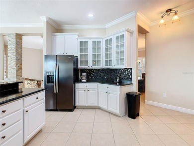 Stunning OPERETTA model on a HUGE POND in the Terra Vista on Stonegate Golf Club in Florida - for sale on GolfHomes.com, golf home, golf lot