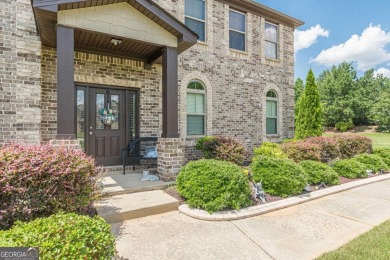 Discover this beautifully designed 4-sided brick home tucked on Crystal Lake Golf and Country Club in Georgia - for sale on GolfHomes.com, golf home, golf lot