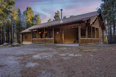 ONE LEVEL log home bordering a greenbelt!  Within 5 minutes of on Angel Fire Resort Country Club in New Mexico - for sale on GolfHomes.com, golf home, golf lot