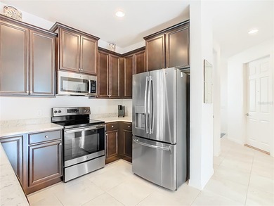 A true gem & priced right! This stunning & spotless BRINDINI on Stonegate Golf Club in Florida - for sale on GolfHomes.com, golf home, golf lot