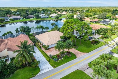 Nestled in the prestigious Marlwood Estates of PGA National on PGA National Golf Club in Florida - for sale on GolfHomes.com, golf home, golf lot