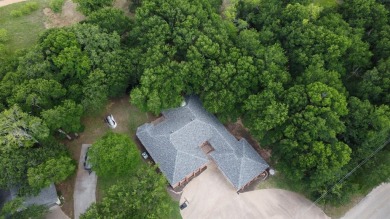 Nestled on a quiet wooded lot with mature shade trees in the on White Bluff Resort - Old Course in Texas - for sale on GolfHomes.com, golf home, golf lot