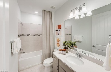Move-in ready and located in the highly desirable gated on Valencia Golf and Country Club in Florida - for sale on GolfHomes.com, golf home, golf lot