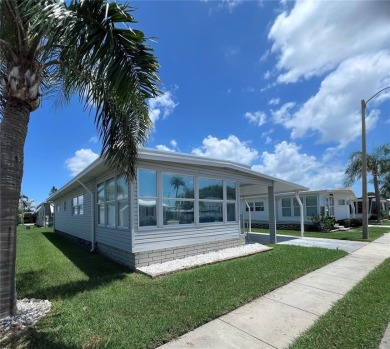 This beautifully maintained 2-bedroom, 2-bath home is truly on Fairway Village Golf Course in Florida - for sale on GolfHomes.com, golf home, golf lot