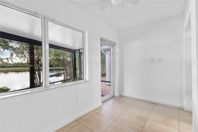 Charming One-Story Home with Golf and Lake Views in Doral Park! on Doral Golf Resort in Florida - for sale on GolfHomes.com, golf home, golf lot