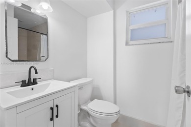 Charming One-Story Home with Golf and Lake Views in Doral Park! on Doral Golf Resort in Florida - for sale on GolfHomes.com, golf home, golf lot