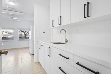 Charming One-Story Home with Golf and Lake Views in Doral Park! on Doral Golf Resort in Florida - for sale on GolfHomes.com, golf home, golf lot