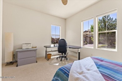 Nestled on a quiet gated street in Somersett, just moments from on Somersett Country Club in Nevada - for sale on GolfHomes.com, golf home, golf lot