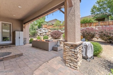 Nestled on a quiet gated street in Somersett, just moments from on Somersett Country Club in Nevada - for sale on GolfHomes.com, golf home, golf lot