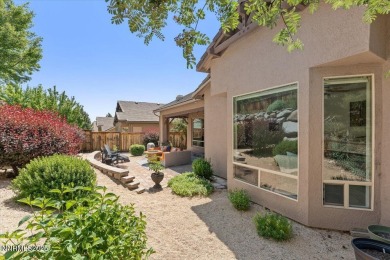 Nestled on a quiet gated street in Somersett, just moments from on Somersett Country Club in Nevada - for sale on GolfHomes.com, golf home, golf lot