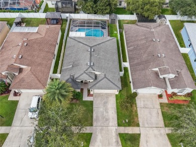 Captivating 4-Bedroom, Pool Home in the Sought-After Lake on The Links of Lake Bernadette in Florida - for sale on GolfHomes.com, golf home, golf lot