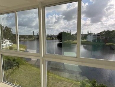 Amazing Water view ALL AROUND. IMPACT WINDOWS AND DOORS FRONT on Hillsboro Pines Golf in Florida - for sale on GolfHomes.com, golf home, golf lot