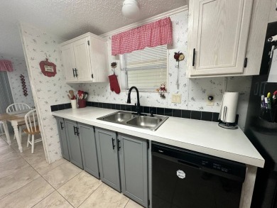 PRICE REDUCED $5,000! Step into this neatly furnished on Four Lakes Golf Club in Florida - for sale on GolfHomes.com, golf home, golf lot