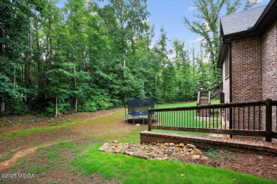 This stunning 4-bedroom, 3.5-bath home on 1.3 acres offers the on The Club River Forest in Georgia - for sale on GolfHomes.com, golf home, golf lot